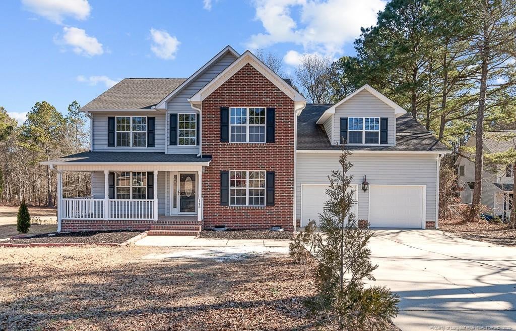 view of front of property with a garage and covered porch