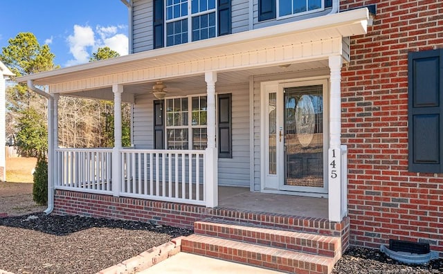 property entrance featuring covered porch