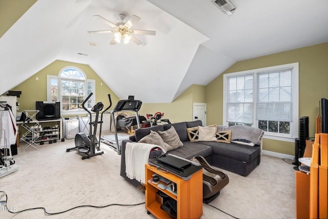 exercise area featuring ceiling fan, lofted ceiling, and light carpet