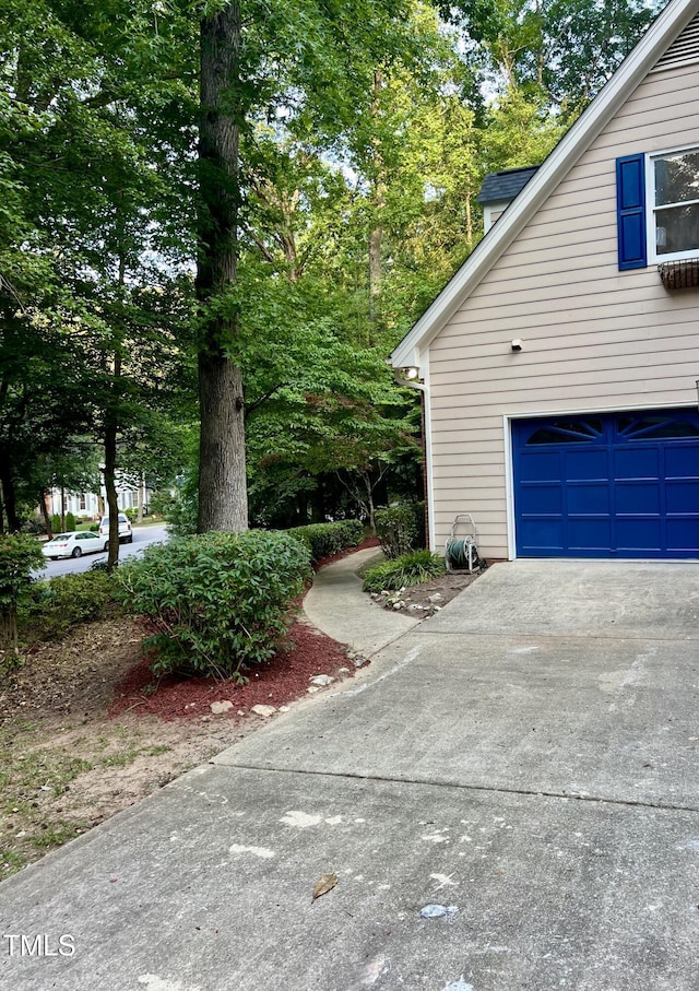 view of property exterior with a garage