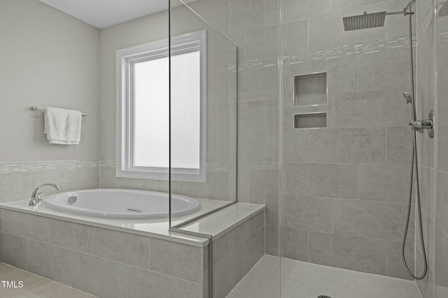 bathroom with separate shower and tub