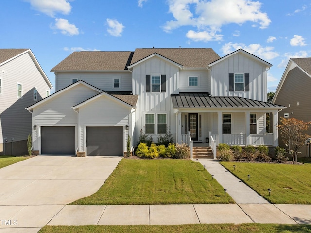 modern farmhouse style home featuring a porch, a garage, and a front lawn