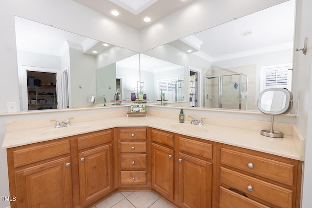 bathroom with an enclosed shower, a skylight, ornamental molding, vanity, and tile patterned flooring