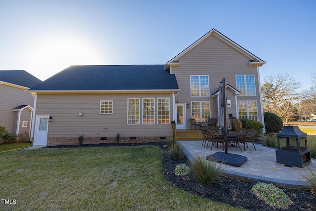 rear view of property with a patio area and a lawn