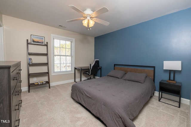 bedroom featuring light colored carpet and ceiling fan