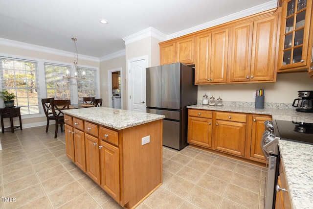 kitchen with stainless steel appliances, light stone counters, ornamental molding, a kitchen island, and decorative light fixtures