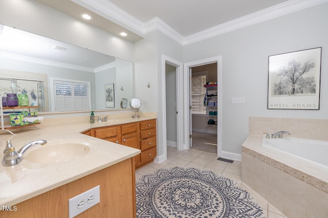 bathroom featuring tile patterned flooring, ornamental molding, a relaxing tiled tub, and vanity