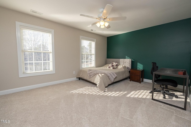 bedroom with light colored carpet and ceiling fan