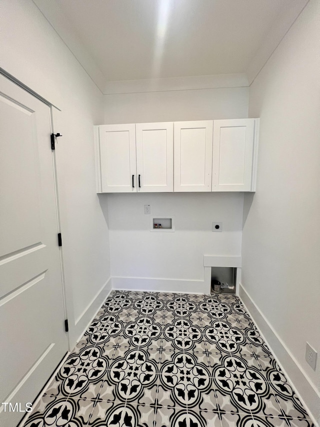 laundry room with light tile patterned floors, hookup for a washing machine, cabinets, crown molding, and hookup for an electric dryer