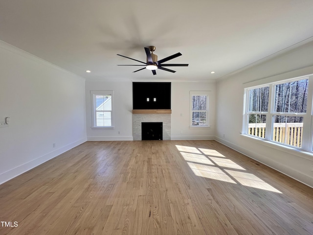 unfurnished living room featuring ceiling fan, light wood-type flooring, and crown molding