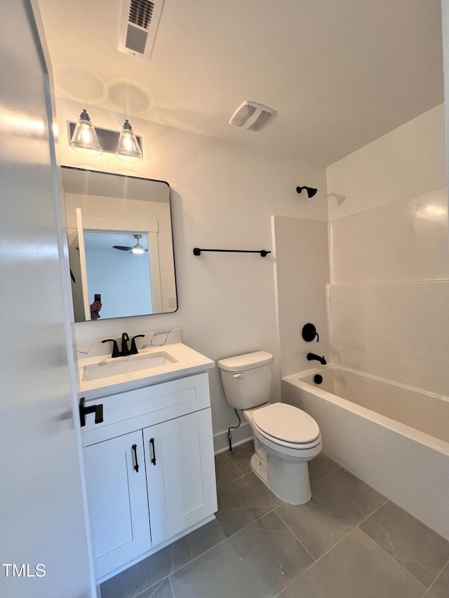 full bathroom featuring toilet, vanity, and shower / bathing tub combination