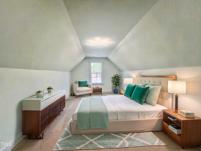 bedroom featuring light colored carpet and lofted ceiling