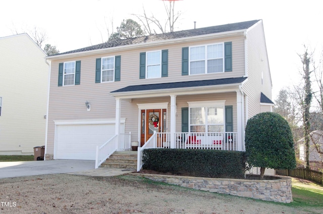 view of front of home with a garage and covered porch