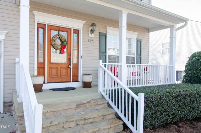 property entrance featuring covered porch