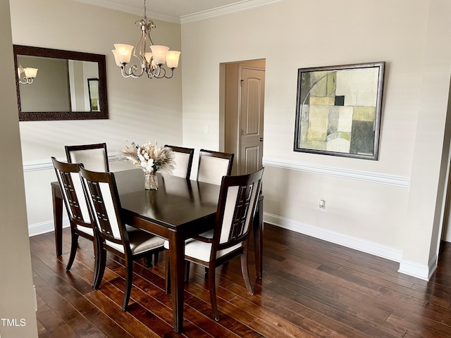 dining area featuring an inviting chandelier, ornamental molding, and dark hardwood / wood-style floors