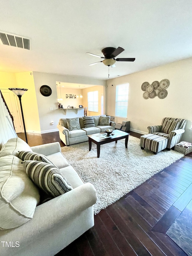 living room with hardwood / wood-style flooring and ceiling fan