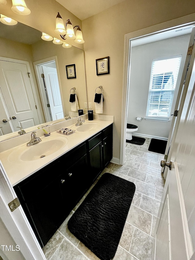 bathroom with vanity and toilet