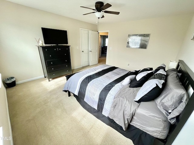 bedroom with light carpet and ceiling fan