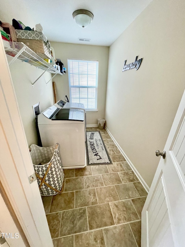 laundry room with washing machine and clothes dryer