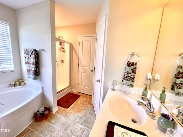 bathroom featuring vanity and separate shower and tub