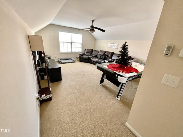 recreation room with ceiling fan, lofted ceiling, and carpet floors