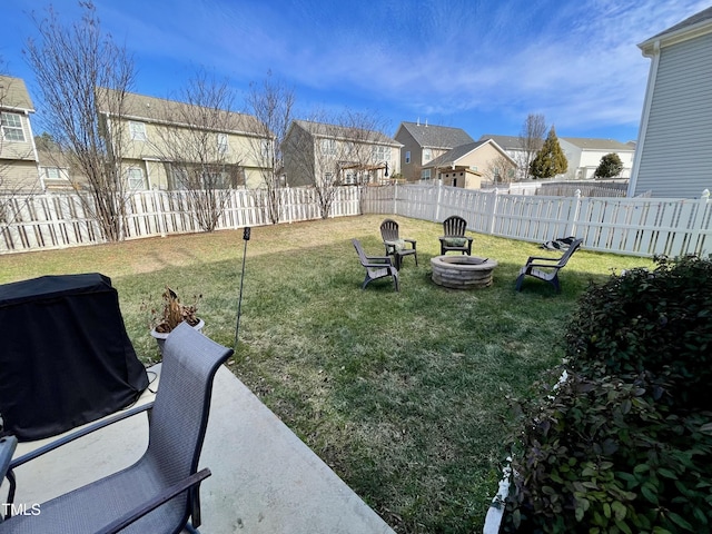 view of yard with a patio area and an outdoor fire pit