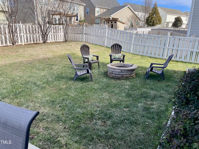 view of yard featuring an outdoor fire pit