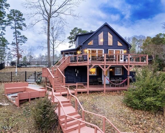 rear view of house with a wooden deck