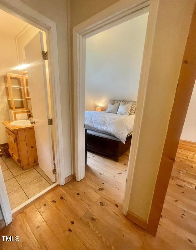 interior space featuring sink and light hardwood / wood-style flooring