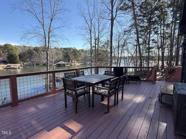 wooden deck featuring a water view