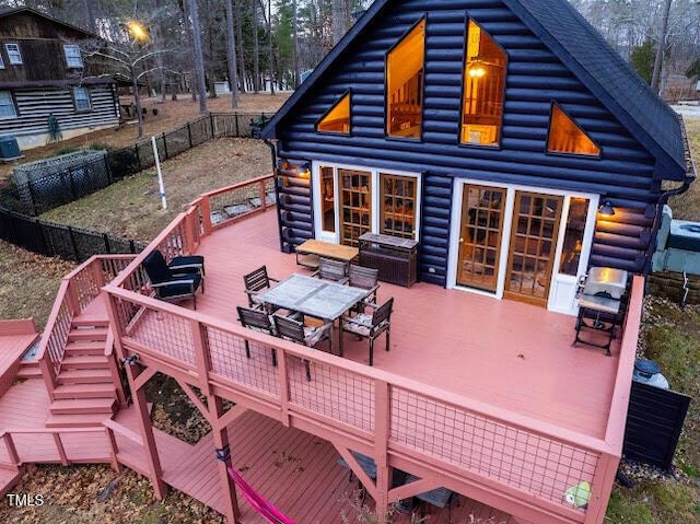 back of property featuring a wooden deck