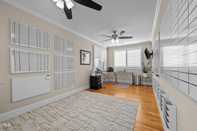 office area featuring ornamental molding, ceiling fan, and light hardwood / wood-style flooring