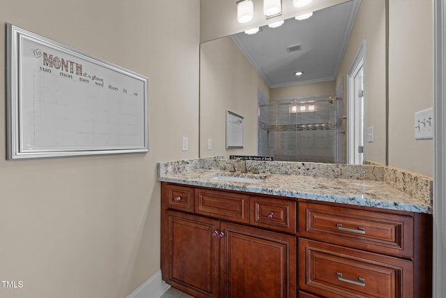 bathroom featuring walk in shower, vanity, and crown molding