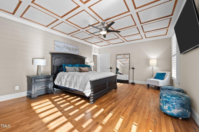 bedroom with hardwood / wood-style flooring and coffered ceiling