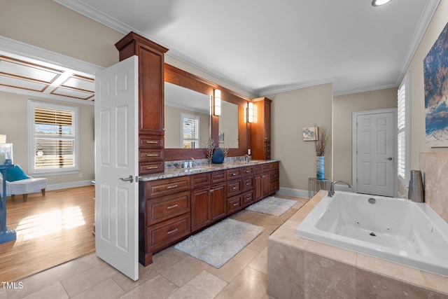 bathroom featuring vanity, tile patterned flooring, a relaxing tiled tub, and ornamental molding