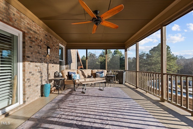 sunroom with wood ceiling, ceiling fan, and plenty of natural light