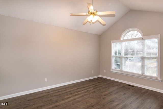 unfurnished room featuring dark hardwood / wood-style flooring, vaulted ceiling, and ceiling fan