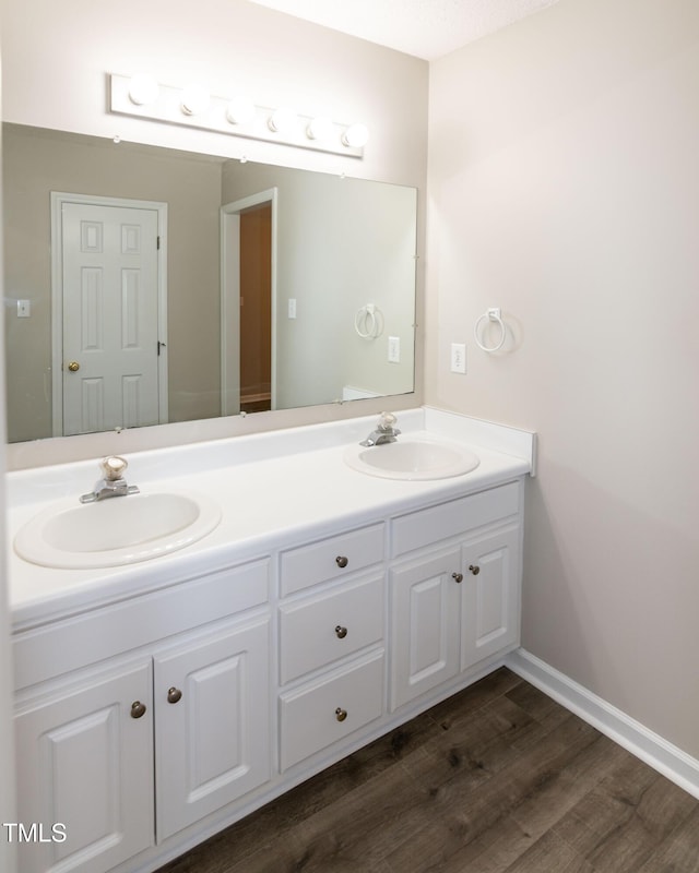 bathroom featuring vanity and hardwood / wood-style floors