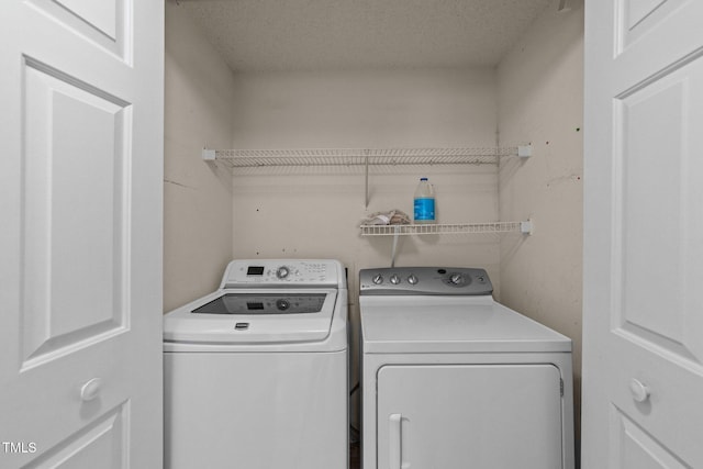 laundry area with laundry area and washing machine and dryer