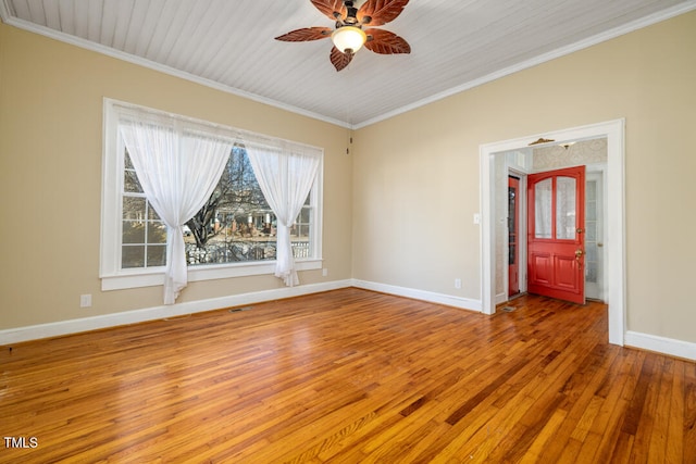 unfurnished room featuring crown molding, wood-type flooring, and ceiling fan