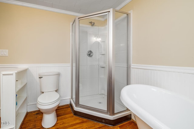 bathroom featuring ornamental molding, toilet, an enclosed shower, and hardwood / wood-style floors