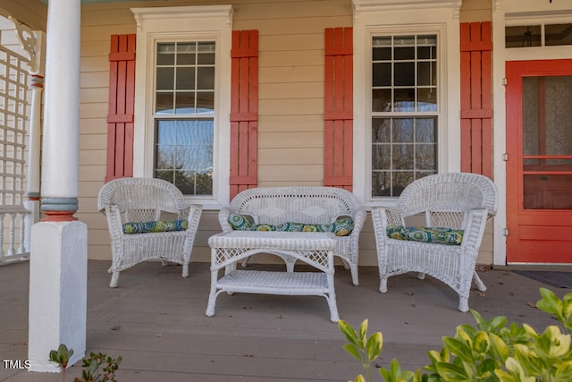 wooden terrace featuring covered porch