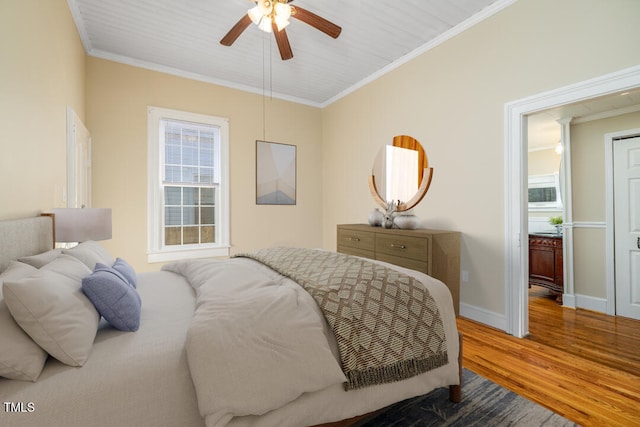 bedroom featuring crown molding, ceiling fan, and hardwood / wood-style flooring