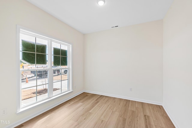 unfurnished room featuring light hardwood / wood-style flooring