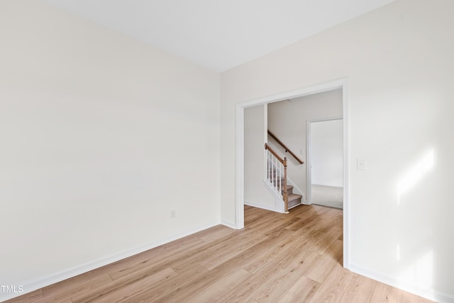 unfurnished room with light hardwood / wood-style floors