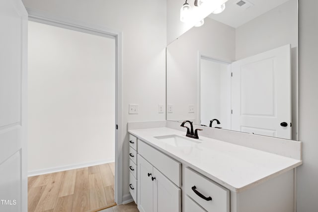 bathroom featuring vanity and wood-type flooring