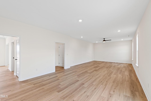 spare room featuring ceiling fan and light wood-type flooring