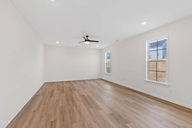 empty room with light hardwood / wood-style flooring and ceiling fan