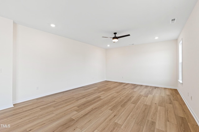 unfurnished room featuring ceiling fan and light hardwood / wood-style floors