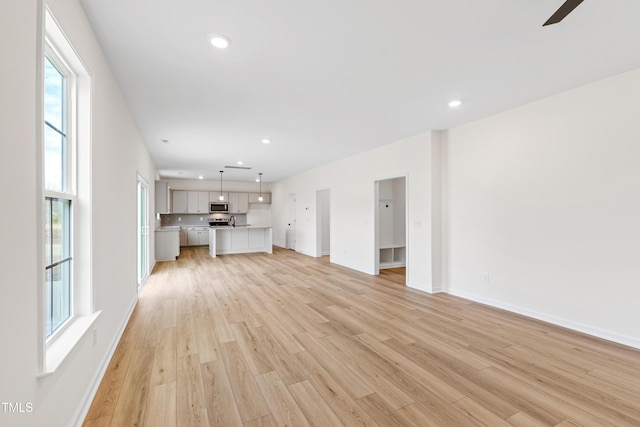 unfurnished living room with light wood-type flooring